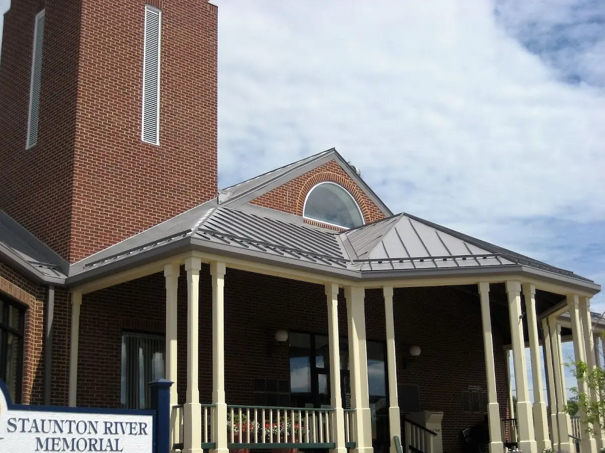 Skilled roofing craftsmen working on a residential roof in North Jackson
